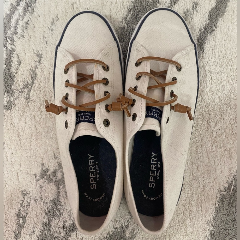 White slip on tennis shoes. Excellent gently used condition.